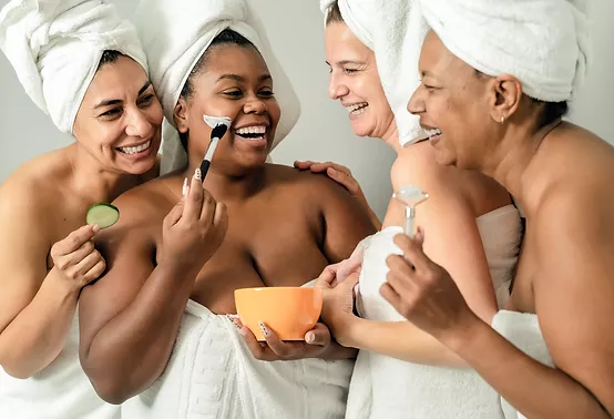 Happy multiracial women with different age and body size having skin care spa day - People